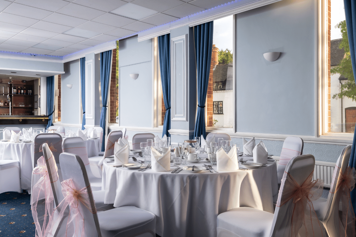 Wedding reception tables beside the suite windows
